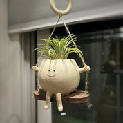 Mini vaso com carinha sorridente balançando