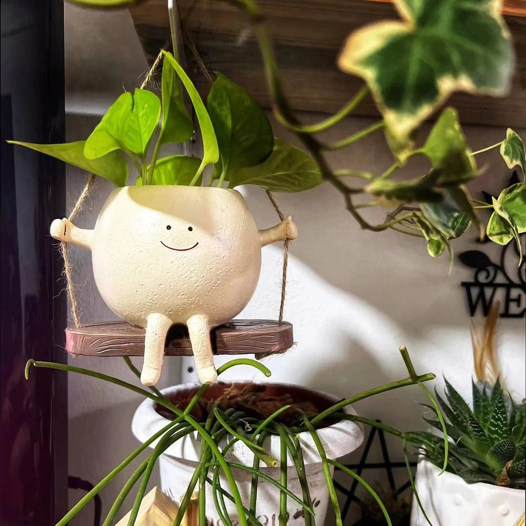 Mini vaso com carinha sorridente balançando